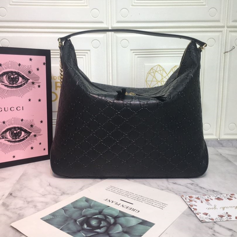 G*u*i top handle bags